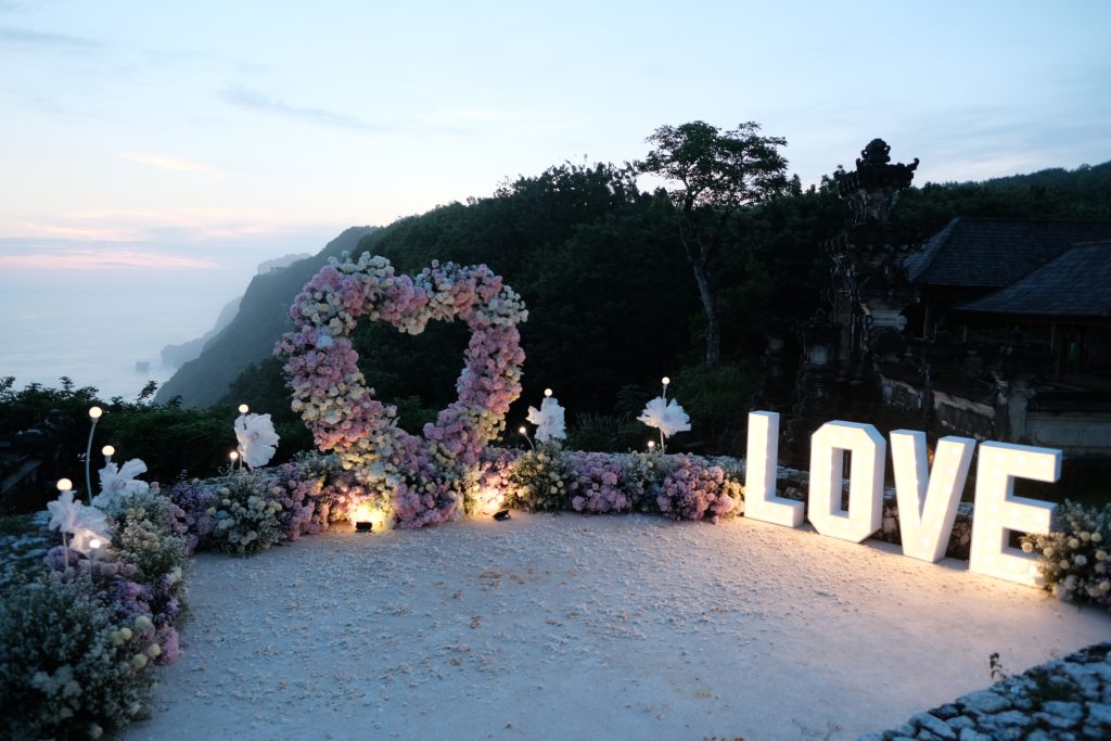 FIX marquee LOVE lights beside ocean sunset