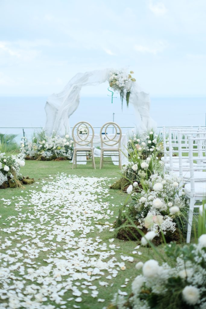wedding aisle with white rose petals