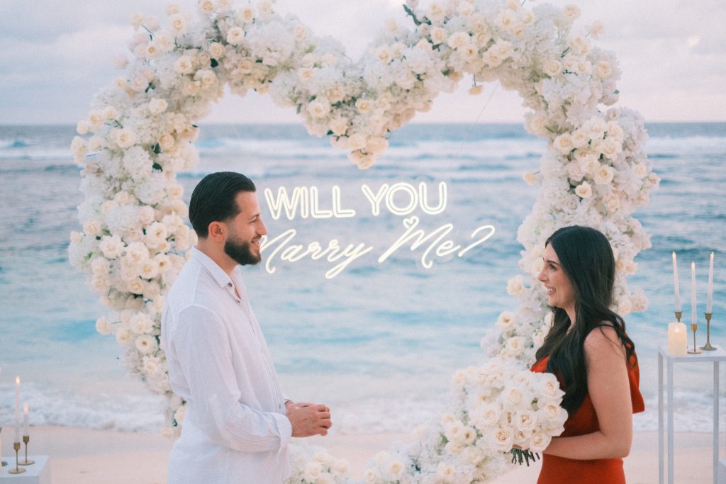 Couple celebrating engagement at Melasti Beach