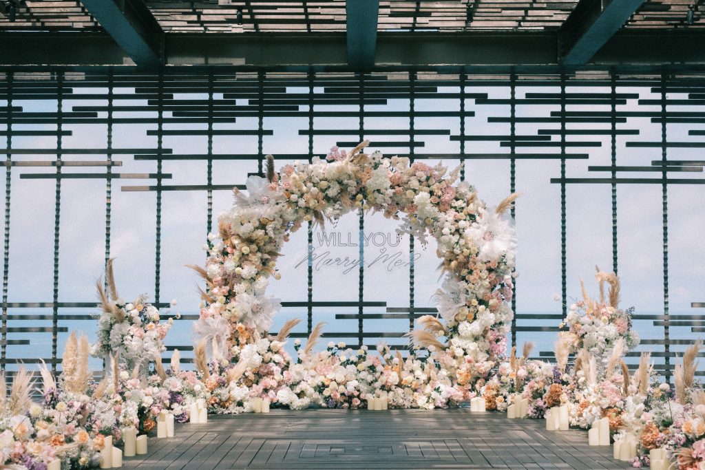 Alila Uluwatu Proposal with pastel floral arch