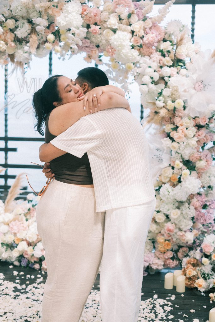 Ashley and Joel celebrating after proposal