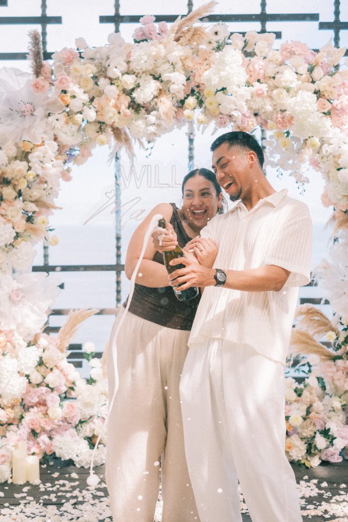 Champagne celebration overlooking Uluwatu cliffs