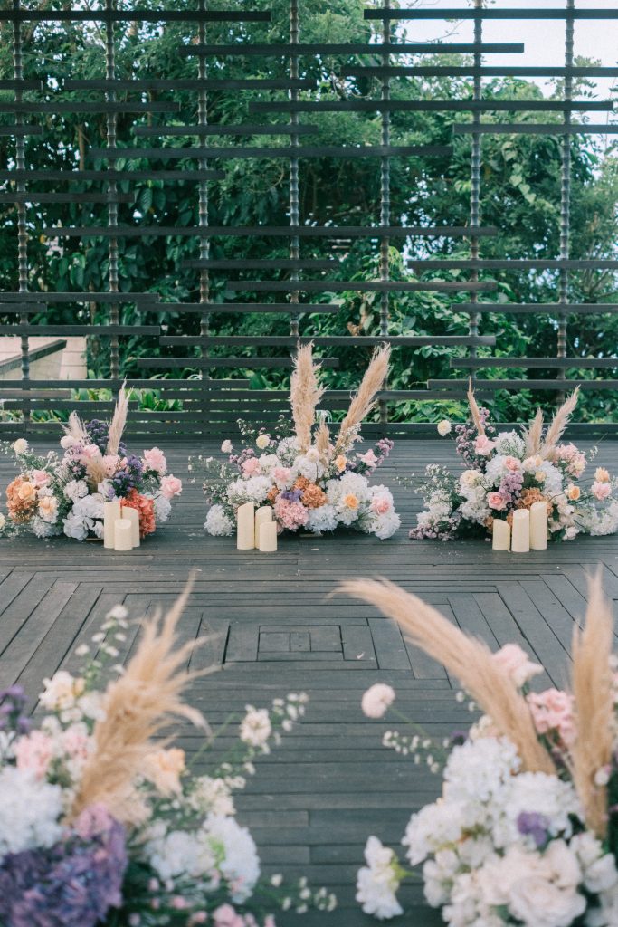 Pampas grass details around circular floral arch
